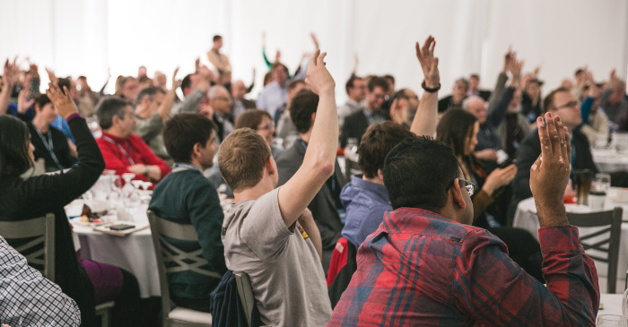 A crowd participating at a conference